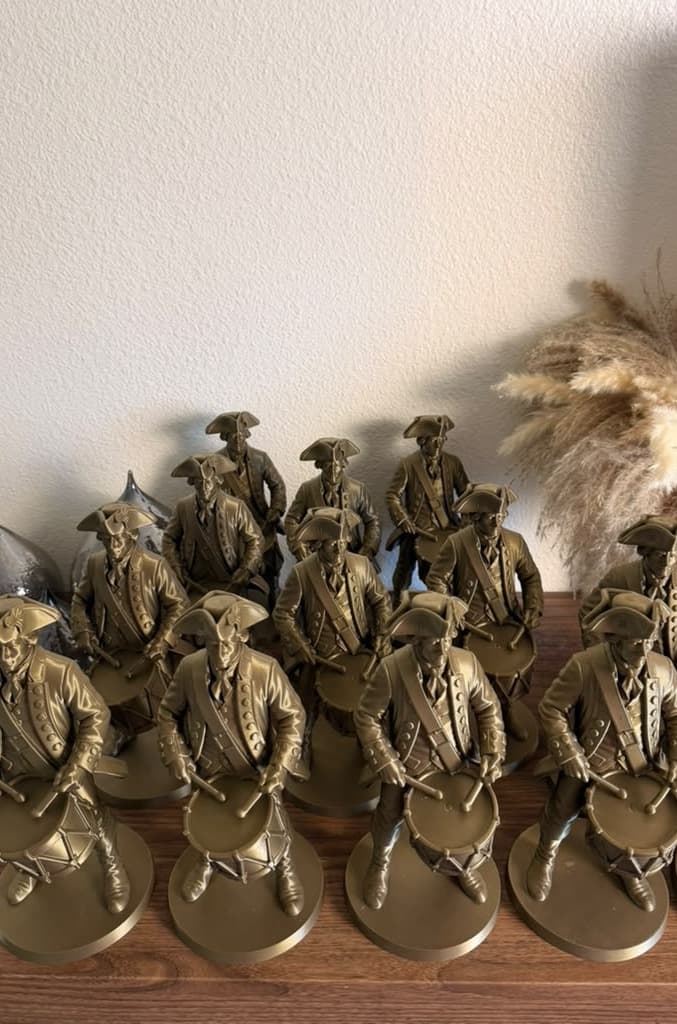 Bronze Colonial Drummer figures seen from the front